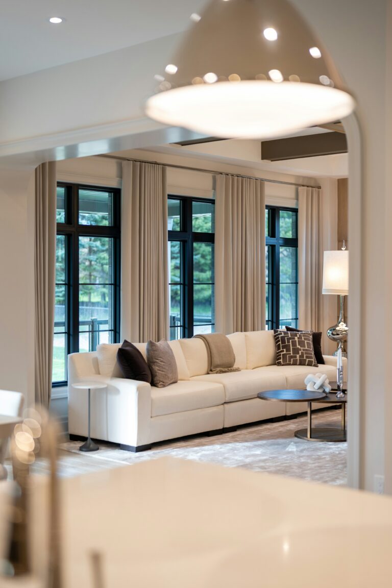Cozy living room with warm lamp light, creating a welcoming home atmosphere