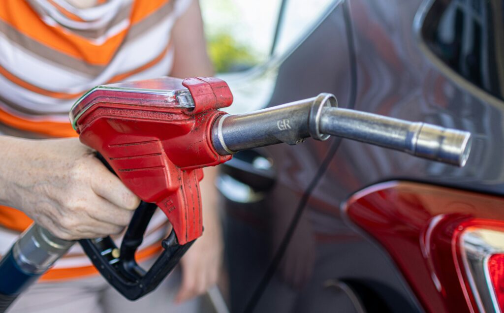 moving back to the US after living abroad — pumping gas at a  station