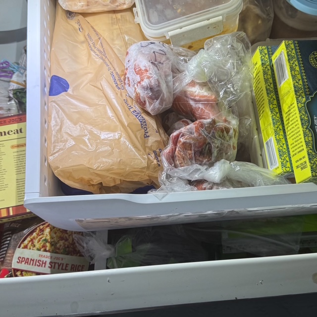 Fall Reset Ideas - Freezer drawer packed with bagged meat and frozen groceries