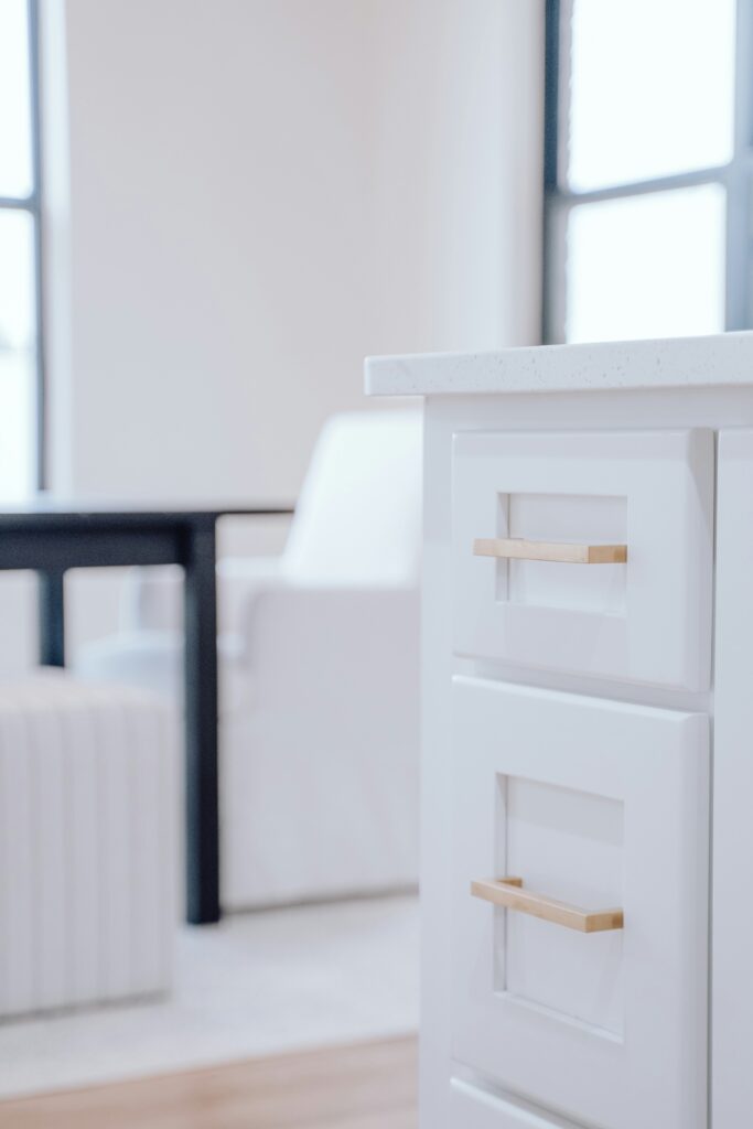 Small Home Upgrades - Close-up of a white cabinet drawer with a  bar pull handle