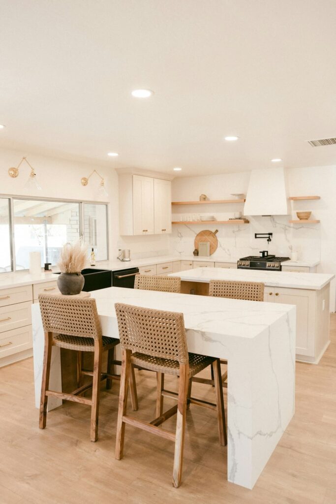 Decluttering before the holidays - Clean, clutter-free kitchen counter with white cabinets and minimal decor